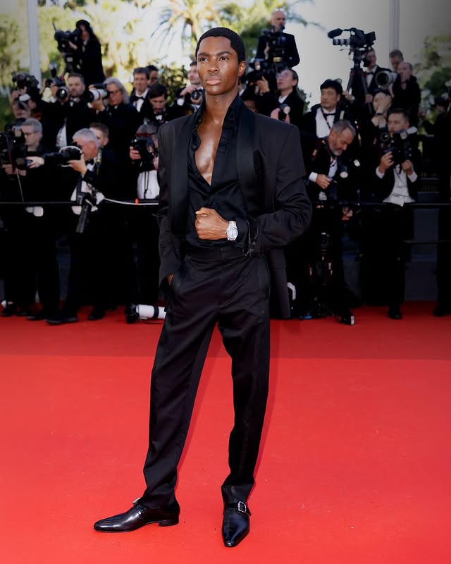 Guests wearing Vivienne Westwood to the 79th Cannes Film Festival, France. @altonmason wore a tuxedo in black virgin wool from the Vivienne Westwood Spring-Summer 2026 collection, with a pair of Vivienne Westwood buckle-fastened shoes in black grain leather. @jellahaase wore a Vivienne Westwood asymmetrical corseted gown in powder blue taffeta. @iamhalsey wore an Andreas Kronthaler for Vivienne Westwood dress, in black wool and duchesse satin with crystal embellishment, to the screening of ‘Sheep in the Box’.@javviercalvo wears a double-breasted jacket and tailored trousers in brown khaki virgin wool, styled with a cotton striped shirt from the Vivienne Westwood Autumn-Winter 2026/27 collection, at ‘La Bola Negra’ photocall.#CannesFilmFestival by @viviennewestwood