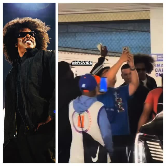 a group of fans forming around Jay-Z trying to get a picture after the game!